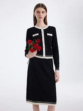 a lady in a contrast trim sequins knitted cardigan and skirt